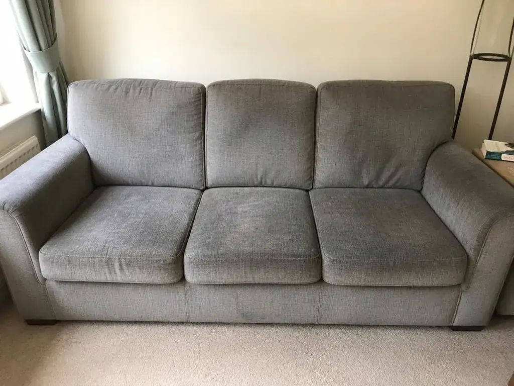 A fabric sofa in a bright living room